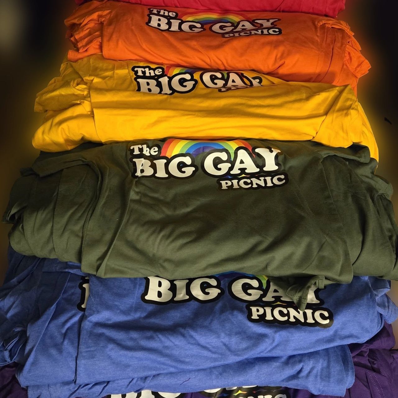A stack of Big Gay Picnic T-shirts